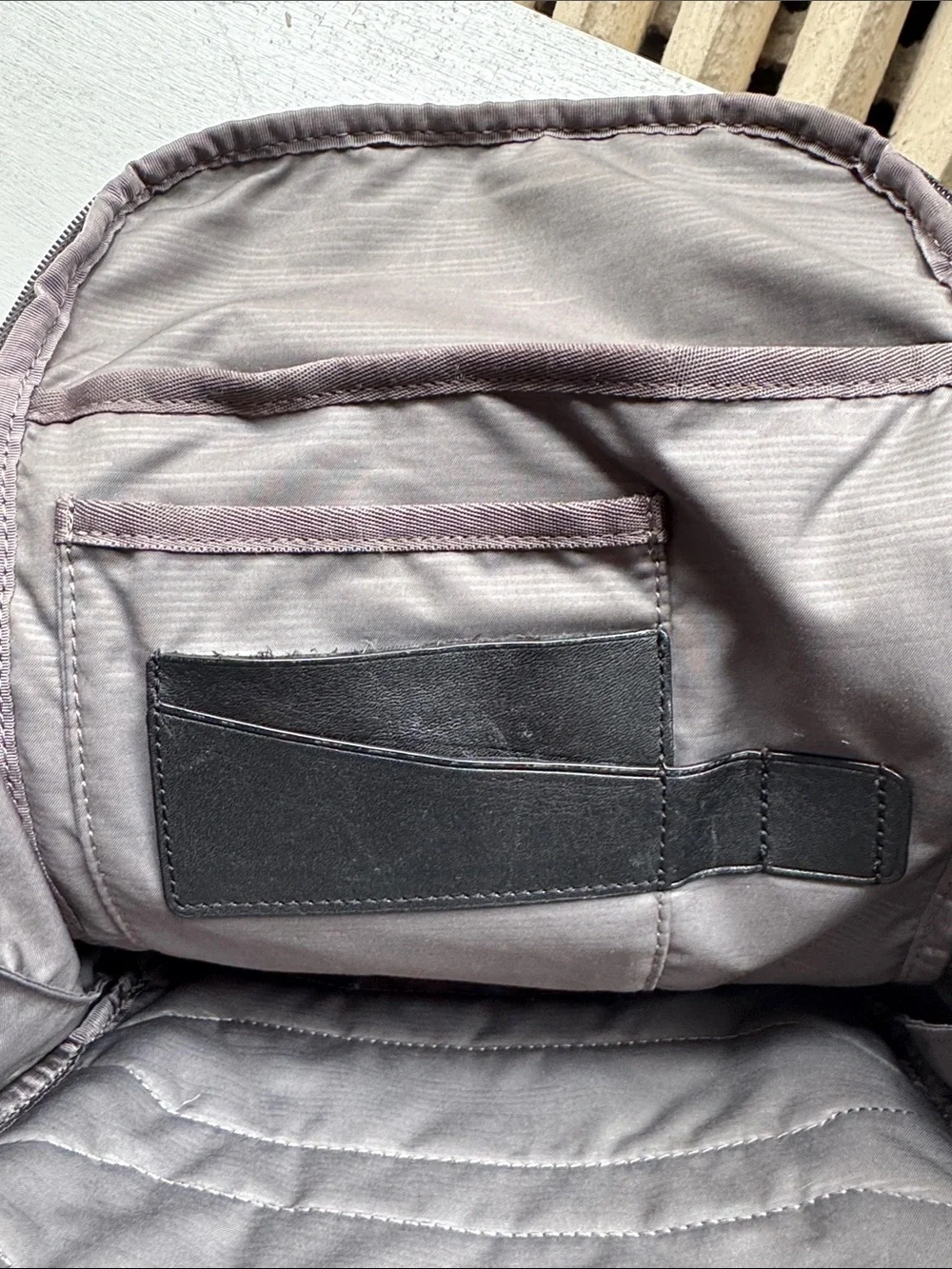 Tumi Black Leather and Brown Leaf-Print Backpack USED